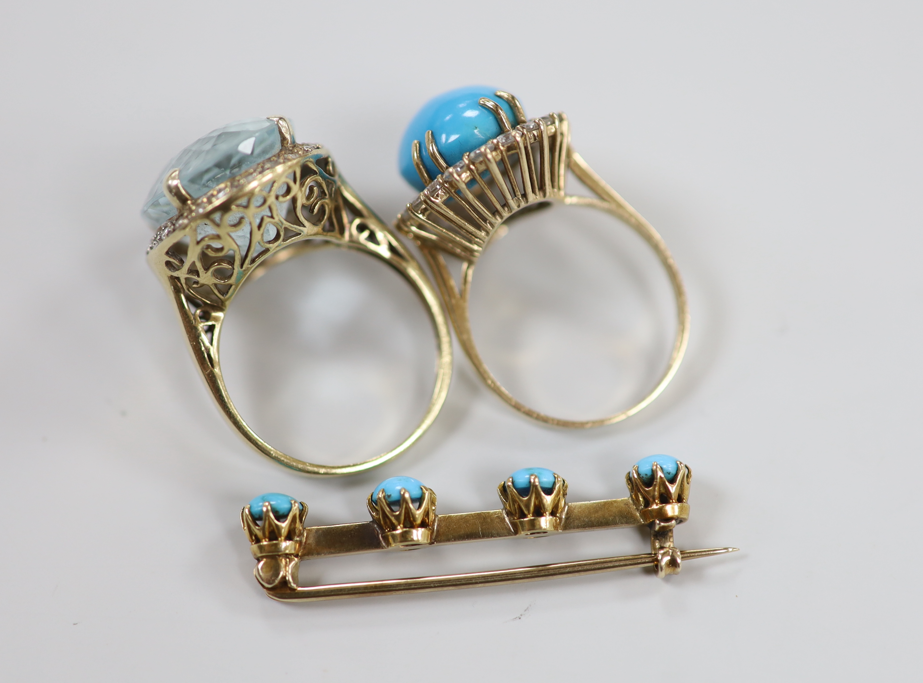 Two modern 9ct and gem set dress rings, including turquoise and simulated diamond set cluster and a yellow metal and four stone turquoise set bar brooch, gross weight 19.6 grams.